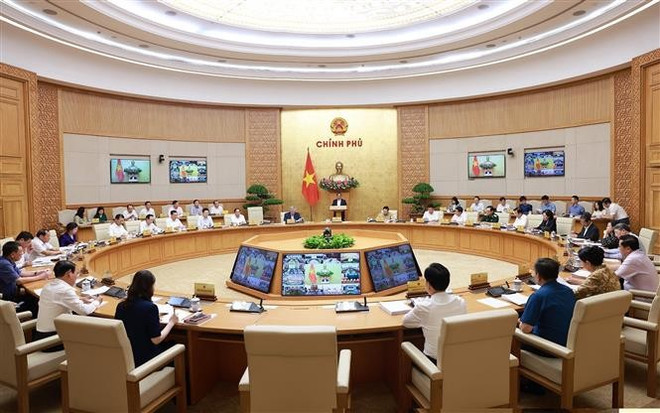 Panorama de la reunión. (Fuente: VNA) vna-potal-thu-tuong-chu-tri-phien-hop-chinh-phu-thuong-ky-thang-6-va-hoi-nghi-truc-tuyen-chinh-phu-voi-cac-dia-phuong-8129254.jpg