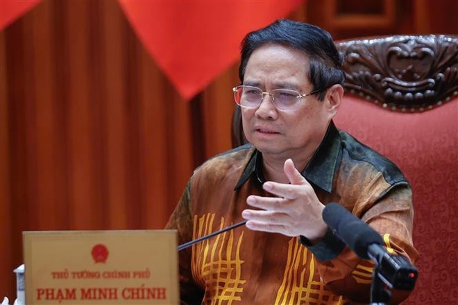 El primer ministro Pham Minh Chinh habla en el evento. (Fuente: VNA) vna-potal-thu-tuong-chu-tri-cuoc-hop-ve-trung-tam-tai-chinh-quoc-te-tai-viet-nam-8048273.jpg