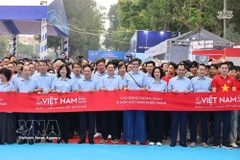 Los delegados participan en la actividad de jogging "Por un Vietnam saludable" (Fuente: VNA) 