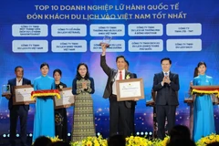 Honran a 10 mejores empresas de viaje internacional que traen turistas a Vietnam. (Fuente: VNA) 