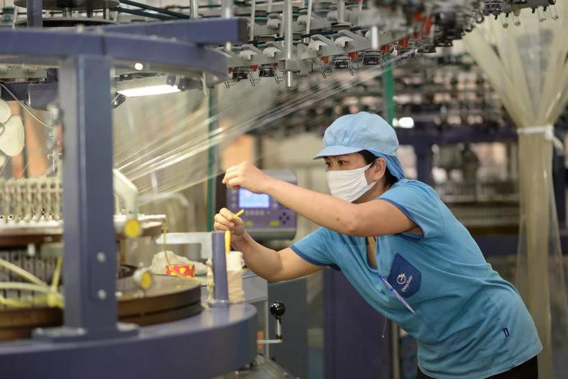 Las empresas textiles y de confección se transforman de forma ecológica, cumpliendo con los altos estándares del mercado. (Foto: PV/Vietnam+)