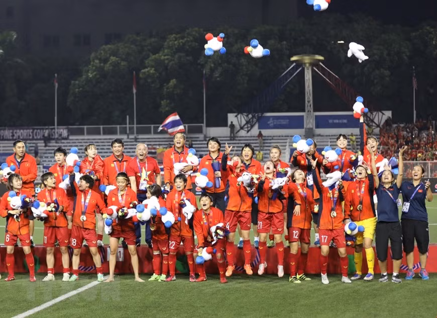 Las jugadoras vietnamitas celebran la victoria (Foto: VNA)