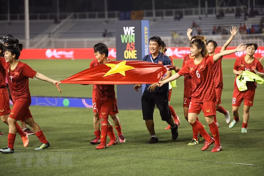 Las jugadoras vietnamitas celebran la victoria (Foto: VNA)