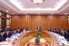 El secretario general del Partido Comunista de Vietnam (PCV), To Lam, preside una sesión de trabajo con los miembros permanentes de los Subcomités encargados del XIV Congreso Nacional del PCV. (Foto: VNA)