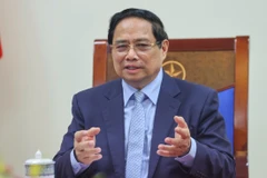 Premier vietnamita mantiene conversación telefónica con canciller alemán. (Foto: VNA)