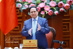 Premier de Vietnam insta a política monetaria y fiscal flexible para alcanzar crecimiento de dos dígitos (Foto: VNA)