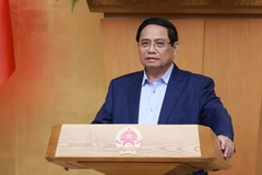 El primer ministro Pham Minh Chinh preside la sesión temática del Gobierno. (Foto: VNA)