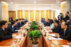 La reunión entre el Ministerio de Construcción de Vietnam y representantes de a Región Autónoma Zhuang de Guangxi (China). (Fuente: Ministerio de Construcción)