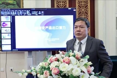 El consejero comercial de Vietnam en China, Nong Duc Lai, habla en el evento. (Fuente: VNA)
