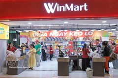 Clientes en el supermercado WinMart. (Fuente: VNA)