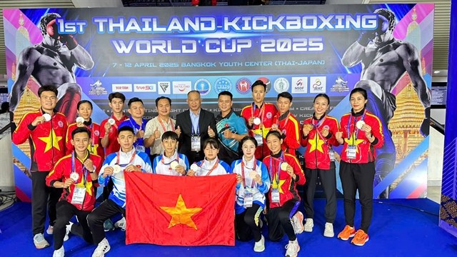 Atletas y entrenadores vietnamitas en el torneo (Foto: VNA)