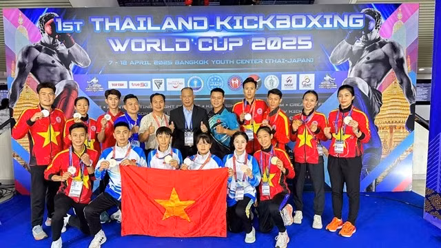 Atletas y entrenadores vietnamitas en el torneo (Foto: VNA)