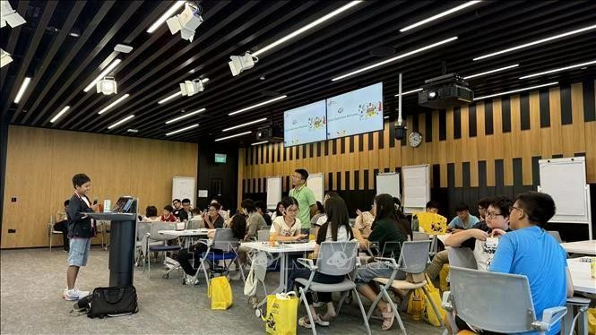 Niños asisten al evento en la Oficina de Google en Singapur. (Foto: VNA)