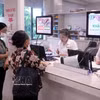 Pago de tasas hospitalarias en el Hospital General de Lam Hoa, en la provincia de Thai Binh. (Fuente: VNA)