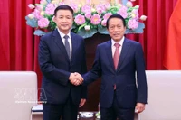 El ministro de Seguridad Pública de Vietnam, Luong Tam Quang, y su homólogo chino, Wang Xiaohong. (Fuente: VNA)