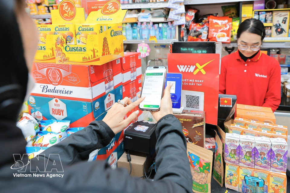 El pago electrónico aumenta la conveniencia, la seguridad y la transparencia de las transacciones. (Foto: VNA)