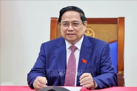 l primer ministro de Vietnam, Pham Minh Chinh, mantiene una conversación telefónica con Alexey Likhachev, director general de la Corporación Estatal Rosatom de Rusia. (Foto: VNA)