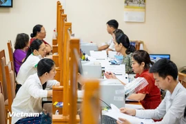 El 20 de junio, a las 8 horas, 126 nuevas comunas y barrios de Hanoi iniciaron simultáneamente las pruebas del modelo de dos niveles. (Foto: VNA)