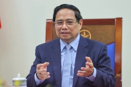 Premier vietnamita mantiene conversación telefónica con canciller alemán. (Foto: VNA)