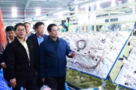 El primer ministro de Vietnam, Pham Minh Chinh, visitó una empresa en la provincia de Quang Nam en febrero. (Fuente: VNA)