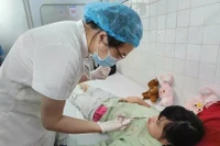 En Vietnam, aproximadamente uno de cada 700 a 800 niños nace con esta afección. (Foto: VNA)