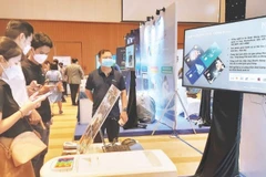 Ciudad Ho Chi Minh exhibe soluciones de transformación digital en conmemoración del Día Nacional de la Transformación Digital. (Foto: https://nhandan.vn/)