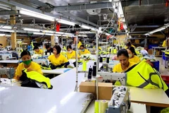 Trabajadores de la empresa textil Dony, comuna de Vinh Loc A, distrito de Binh Chanh, Ciudad Ho Chi Minh. (Foto: VNA)