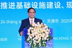 El primer ministro vietnamita, Pham Minh Chinh, habla en el Foro de conexión empresarial Vietnam - China. (Fuente: VNA)