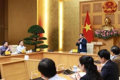 El primer ministro de Vietnam, Pham Minh Chinh, preside una conferencia sobre la plataforma nacional de datos. (Foto: VNA)