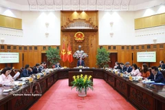 El primer ministro de Vietnam, Pham Minh Chinh, en su calidad de jefe del Comité Directivo Nacional para la Inclusión Financiera, preside la tercera reunión del organismo. (Foto: VNA)