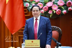 El primer ministro de Vietnam, Pham Minh Chinh, en su calidad de jefe del Comité Directivo Nacional para la Inclusión Financiera, preside la tercera reunión del organismo. (Foto: VNA)