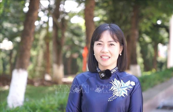 Dao Thi Thanh Nhan, subjefa de la Comisión de Propaganda, Educación y Movilización de Masas del Comité del PCV en Lai Chau (Foto: VNA) vna-potal-gop-y-du-thao-van-kien-dai-hoi-dang-xiv-niem-tin-va-khat-vong-phat-trien-dat-nuoc-hung-cuong-hanh-phuc-stand-1.jpg
