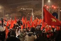 Aficionados celebran la victoria de la selección sub-23. Foto: VNA