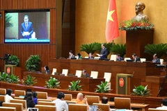 El presidente de la Asamblea Nacional de Vietnam, Tran Thanh Man, dirige una sesión de interpelaciones (Foto: VNA)