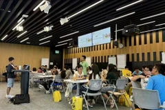 Niños asisten al evento en la Oficina de Google en Singapur. (Foto: VNA)