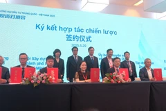 En la ceremonia de firma entre el NSSC y el CCPIT (Foto: VNA)