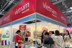 En el pabellón de Vietnam (Foto: VNA)