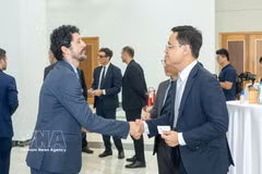 Empresarios vietnamitas e italianos en la cita (Foto: VNA)
