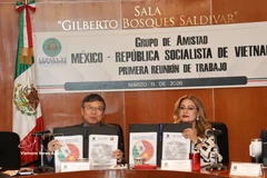 Ceremonia de firma de la agenda de cooperación parlamentaria Vietnam-México (Foto: VNA)