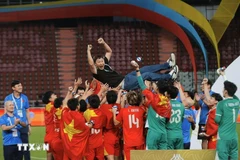 La selección vietnamita celebra su victoria (Foto: VNA)