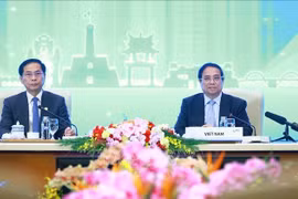 El primer ministro de Vietnam, Pham Minh Chinh, preside la sesión “Transición verde sostenible y centrada en las personas” en el marco de la Cumbre P4G en Hanoi. (Foto: VNA)