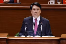 El miembro del Buró Político y presidente de la República, Luong Cuong, pronuncia el discurso de apertura del XIV Congreso Nacional del Partido Comunista de Vietnam. (Foto: VNA)