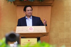 El primer ministro Pham Minh Chinh preside la reunión ordinaria de Gobierno de mes de agosto (Foto: VNA)