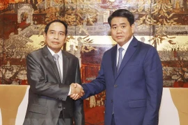  Hanoi y Laos comparten experiencias en el trabajo de inspección