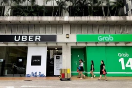 Singapur establece medidas provisionales para la fusión Grab-Uber