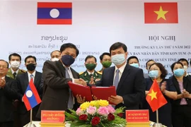 Provincias vietnamita y laosiana buscan cooperar en prevención y control de desastres naturales