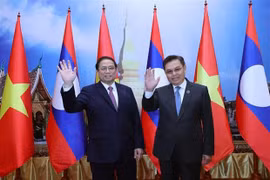Vietnam y Laos atesoran a consolidar la gran amistad y cooperación integral bilateral