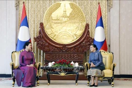 Uniones de Mujeres de Vietnam y Laos fortalecen cooperación bilateral
