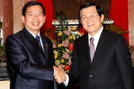 El presidente vietnamita, Truong Tan Sang, recibe al titular laosiano del Tribunal Supremo Popular, Khamphanh Sithidampha, (Fuente:VNA)