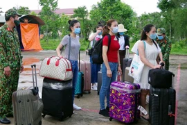 Vietnamitas repatriados desde Singapur completan período de cuarentena